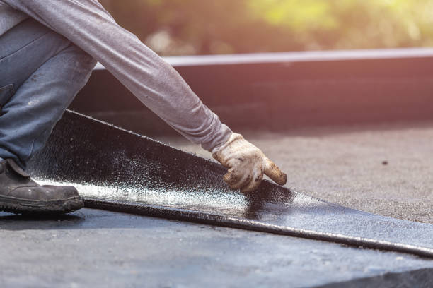 Professional Waterproofing technician working in Riverside, NY